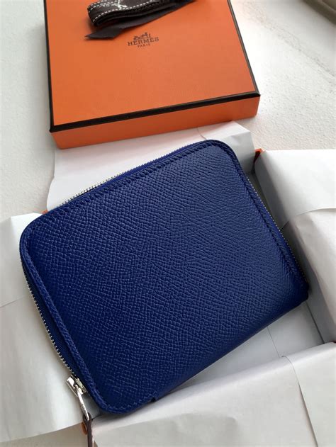 hermes silk in compact wallet.